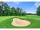 Scenic view of the lush green golf course with a sand trap under a bright, sunny sky at 2317 Whiting Bay Courts Nw, Kennesaw, GA 30152