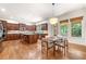 Gourmet kitchen with stainless steel appliances, granite countertops, a large island, and a cozy breakfast nook at 2317 Whiting Bay Courts Nw, Kennesaw, GA 30152