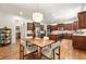 Elegant kitchen with custom cabinets, stainless steel appliances, and an adjacent dining area perfect for entertaining at 2317 Whiting Bay Courts Nw, Kennesaw, GA 30152