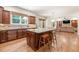 Open kitchen layout with a granite island, stainless appliances, and seamless connection to the living area, ideal for gatherings at 2317 Whiting Bay Courts Nw, Kennesaw, GA 30152