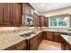 Stylish kitchen showcasing granite countertops, custom cabinetry, and stainless steel appliances for a modern culinary experience at 2317 Whiting Bay Courts Nw, Kennesaw, GA 30152