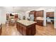 Spacious kitchen with a large island, granite countertops, stainless steel appliances, and an open layout to the living area at 2317 Whiting Bay Courts Nw, Kennesaw, GA 30152
