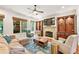 Inviting living room featuring a stone fireplace, built-in shelving, and comfortable seating arrangement at 2317 Whiting Bay Courts Nw, Kennesaw, GA 30152