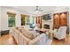 Inviting living room boasts a stone fireplace, built-in shelving, and natural light at 2317 Whiting Bay Courts Nw, Kennesaw, GA 30152