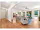 Open-concept living room flows seamlessly from the dining room, offering ample space for entertaining at 2317 Whiting Bay Courts Nw, Kennesaw, GA 30152