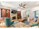 Well-lit living room with fireplace, built-ins, and comfortable seating, creating a cozy and inviting space at 2317 Whiting Bay Courts Nw, Kennesaw, GA 30152