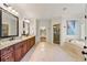 Bright bathroom with double vanities, separate shower, and large soaking tub at 2317 Whiting Bay Courts Nw, Kennesaw, GA 30152