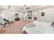 Large main bedroom with sitting area, full length mirror, and access to main bathroom at 2317 Whiting Bay Courts Nw, Kennesaw, GA 30152