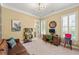 Bright and stylish home office with large window, modern desk, and comfortable leather sofa at 2317 Whiting Bay Courts Nw, Kennesaw, GA 30152
