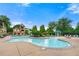 Beautiful community pool with a water slide and plenty of seating on a sunny day at 2317 Whiting Bay Courts Nw, Kennesaw, GA 30152