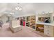 Expansive walk-in closet with custom built-in shelving and vanity area at 2317 Whiting Bay Courts Nw, Kennesaw, GA 30152
