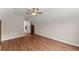 Spacious bedroom featuring hardwood floors, ceiling fan, natural light, and neutral wall color at 2979 Overwood Sw Ln, Snellville, GA 30078