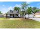 Inviting two-story home featuring a covered front porch and attached two-car garage at 2979 Overwood Sw Ln, Snellville, GA 30078