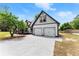 Spacious two-car garage with a wide driveway, adjacent to the main house at 2979 Overwood Sw Ln, Snellville, GA 30078
