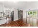 Charming living room featuring hardwood floors, open layout, and a stylish barn door to the staircase at 2979 Overwood Sw Ln, Snellville, GA 30078