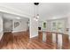 Open living room with hardwood floors, fireplace, and access to an outdoor deck through French doors at 2979 Overwood Sw Ln, Snellville, GA 30078