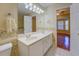 Bathroom features a double sink vanity with white cabinets and a large mirror at 502 Brookline Pl, Mcdonough, GA 30252