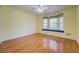 Bright bedroom with hardwood floors and large bay window featuring built-in seating at 502 Brookline Pl, Mcdonough, GA 30252