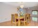 Traditional dining room with chandelier lighting, wood floors, and seating for six at 502 Brookline Pl, Mcdonough, GA 30252