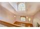 Open foyer featuring hardwood floors, natural light from a transom window and traditional fixtures at 502 Brookline Pl, Mcdonough, GA 30252