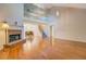 Open living room with hardwood floors, fireplace, and soaring vaulted ceilings at 502 Brookline Pl, Mcdonough, GA 30252