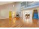 Spacious living room with hardwood floors, fireplace, and stairway to second level at 502 Brookline Pl, Mcdonough, GA 30252