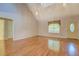 Bright living room featuring hardwood floors and vaulted ceilings at 502 Brookline Pl, Mcdonough, GA 30252