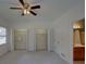 Bedroom featuring two closets, a window, neutral carpet, and attached bathroom at 1453 Cambridge Cmn, Decatur, GA 30033
