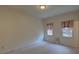 Neutral carpeted bedroom with natural light from the windows at 1453 Cambridge Cmn, Decatur, GA 30033