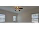 Spacious bedroom with neutral paint, ceiling fan, and bright windows with blinds at 1453 Cambridge Cmn, Decatur, GA 30033