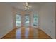 Bright dining area featuring hardwood floors, white trim, and several windows offering natural light at 1453 Cambridge Cmn, Decatur, GA 30033