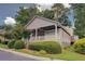 Charming home featuring a covered porch, a well-maintained lawn, and mature trees for added curb appeal at 1453 Cambridge Cmn, Decatur, GA 30033