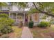 Beautiful home with a covered front porch, well-manicured lawn, and inviting curb appeal at 1453 Cambridge Cmn, Decatur, GA 30033