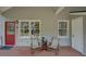 Relaxing front porch with seating area, ideal for enjoying the neighborhood views and fresh air at 1453 Cambridge Cmn, Decatur, GA 30033