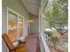 Charming front porch with outdoor seating, offering a relaxing space to enjoy the neighborhood scenery at 1453 Cambridge Cmn, Decatur, GA 30033
