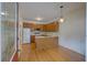 Traditional kitchen featuring wood cabinets, white appliances, and hardwood flooring at 1453 Cambridge Cmn, Decatur, GA 30033