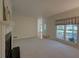 Inviting living room featuring a fireplace, neutral carpet, and plenty of space at 1453 Cambridge Cmn, Decatur, GA 30033