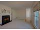 Inviting living room featuring a fireplace, neutral carpet, and plenty of space at 1453 Cambridge Cmn, Decatur, GA 30033