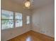 Bright room with hardwood floors, featuring a glass-paneled door and a view of the neighborhood at 1453 Cambridge Cmn, Decatur, GA 30033