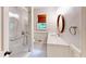 Bright bathroom with tiled shower with glass doors, and vanity with custom fixtures at 203 Cedar Creek Ct, Acworth, GA 30101