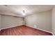 Spacious bedroom with hardwood floors, ample lighting, and space for storage at 203 Cedar Creek Ct, Acworth, GA 30101