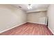 Inviting bedroom space showcasing hardwood floors and natural light from overhead lighting at 203 Cedar Creek Ct, Acworth, GA 30101