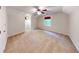 Spacious bedroom with neutral carpeting, fan, two windows, and textured ceiling at 203 Cedar Creek Ct, Acworth, GA 30101