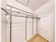 Walk-in closet featuring chrome organizers, carpeted floor, and ample storage at 203 Cedar Creek Ct, Acworth, GA 30101