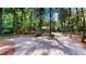 Long driveway leading to a secluded home, surrounded by mature trees at 203 Cedar Creek Ct, Acworth, GA 30101