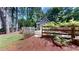 Charming home exterior with well-maintained landscaping and a split rail fence at 203 Cedar Creek Ct, Acworth, GA 30101