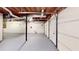 Unfinished basement garage with concrete flooring, exposed beams, and natural light at 203 Cedar Creek Ct, Acworth, GA 30101