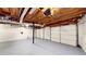 Spacious basement garage features concrete floors, exposed beams, and garage doors at 203 Cedar Creek Ct, Acworth, GA 30101