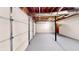 The basement garage showcases concrete flooring, exposed beams, and is ready for customization at 203 Cedar Creek Ct, Acworth, GA 30101