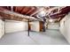 Large unfinished basement garage featuring exposed beams, concrete flooring, and abundant open space at 203 Cedar Creek Ct, Acworth, GA 30101